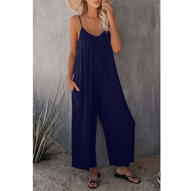 Women's navy blue loose sleeveless jumpsuit with pockets, perfect for summer casual wear.