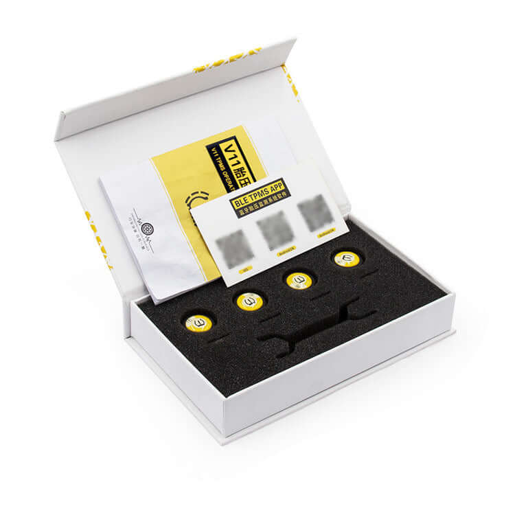 External tire pressure monitor kit with Bluetooth support, includes sensors and user manual in a compact box.