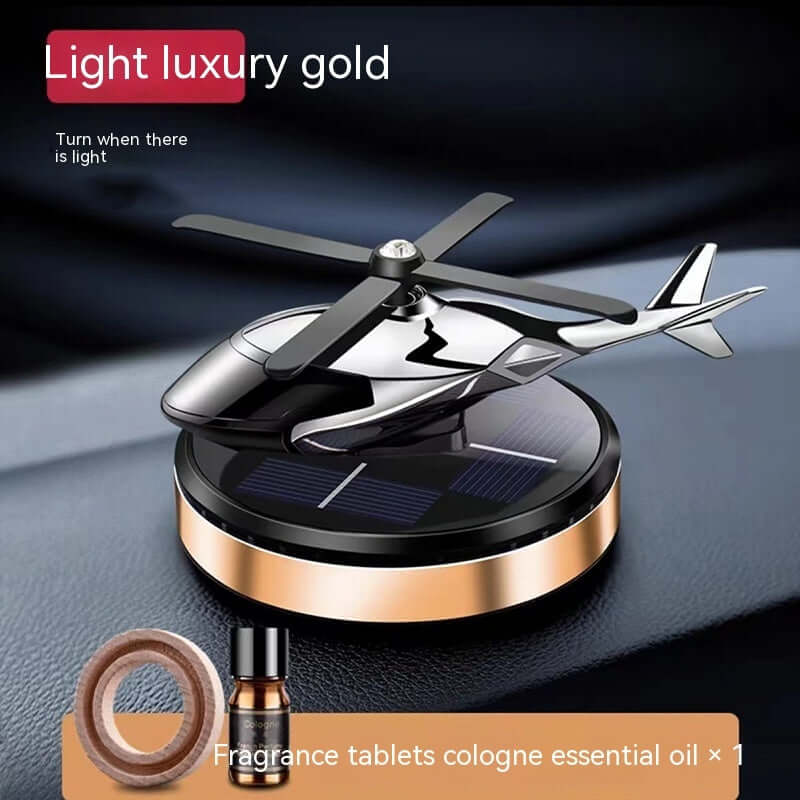 Light luxury gold helicopter car perfume holder with solar base and fragrance tablets for aromatherapy decoration.