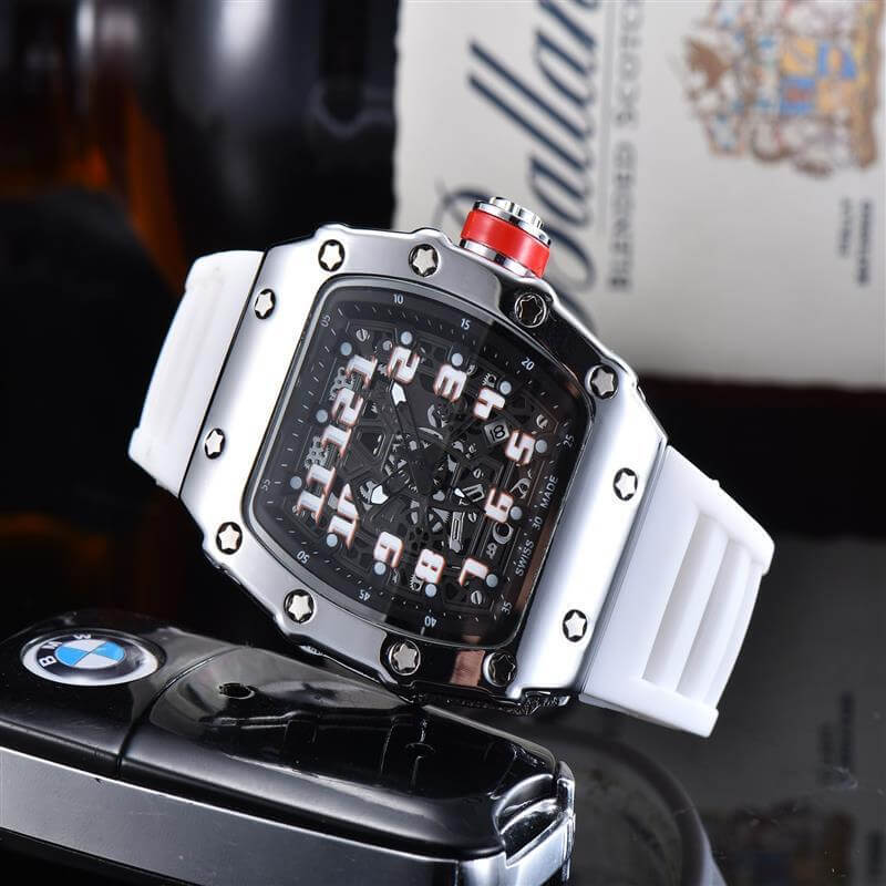 White rubber strap quartz watch with black dial and stainless steel case, alongside a car key fob.