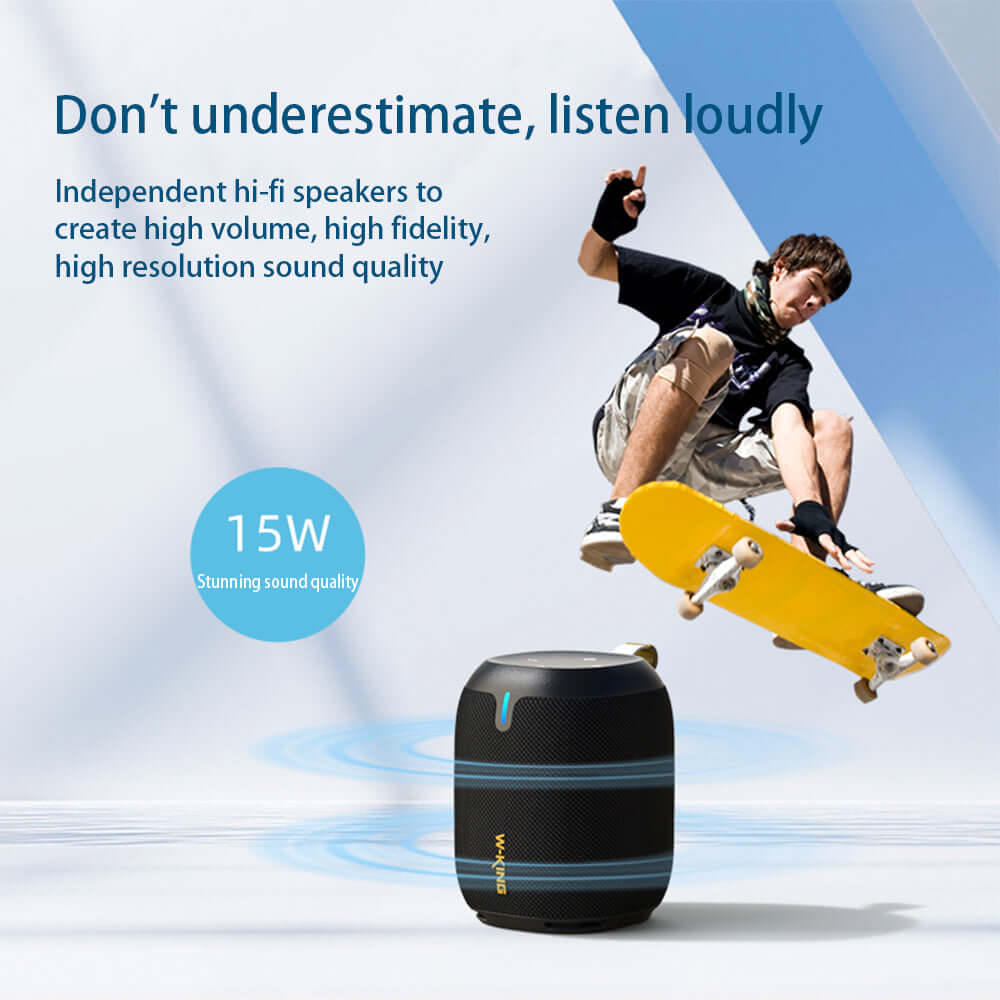 Black portable Bluetooth speaker with hi-fi sound quality beside a skateboarder performing a trick.