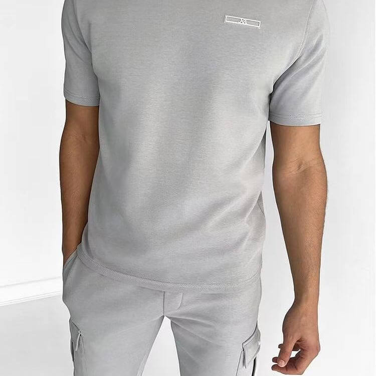 Men's light gray casual sports t-shirt and matching pants, featuring a comfortable fit and multi-pocket design.