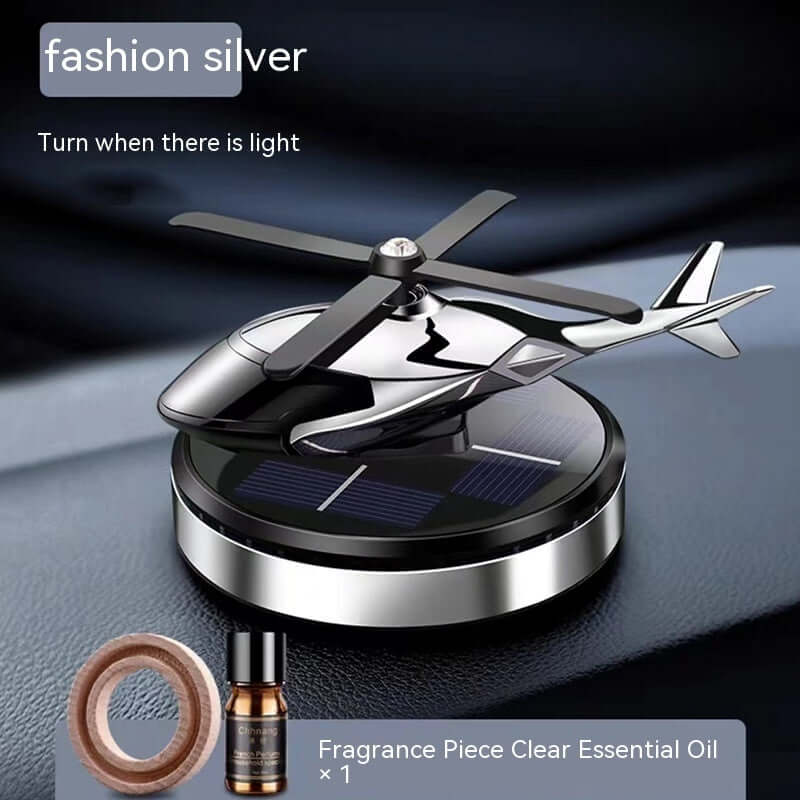 Stylish silver helicopter design car perfume holder with essential oil for aromatherapy decoration.