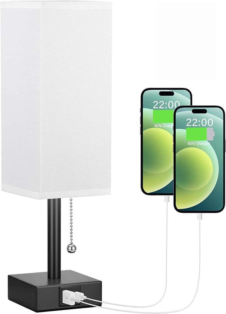 Bedside table lamp with pull chain, USB C and A ports, charging two smartphones, stylish and functional design.