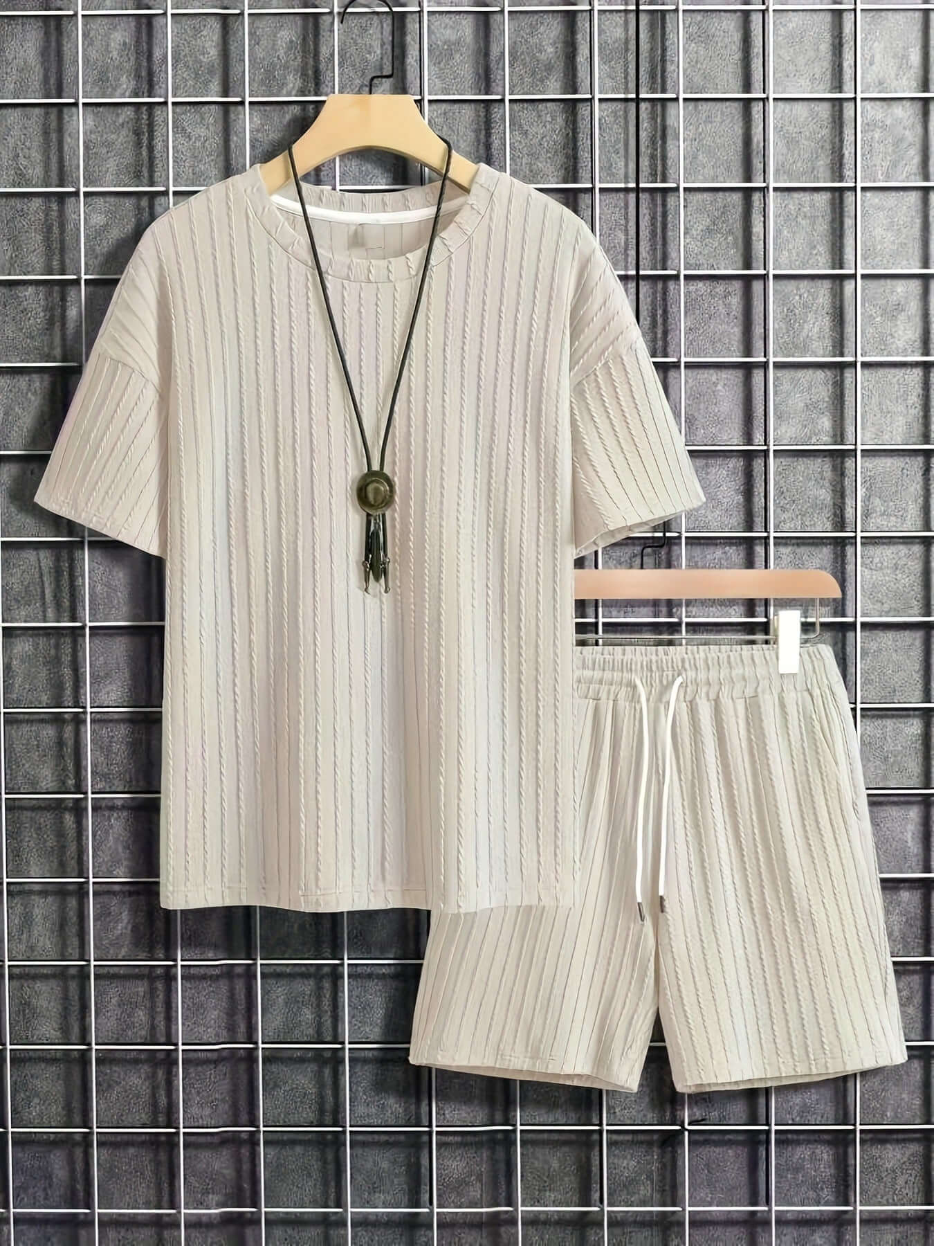 Men's solid color short sleeve casual knitting suit in milky white, featuring matching shorts and lightweight fabric.