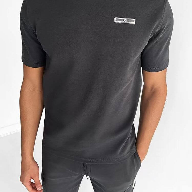 Men's casual black sports t-shirt with short sleeves and logo detail, ideal for activewear.