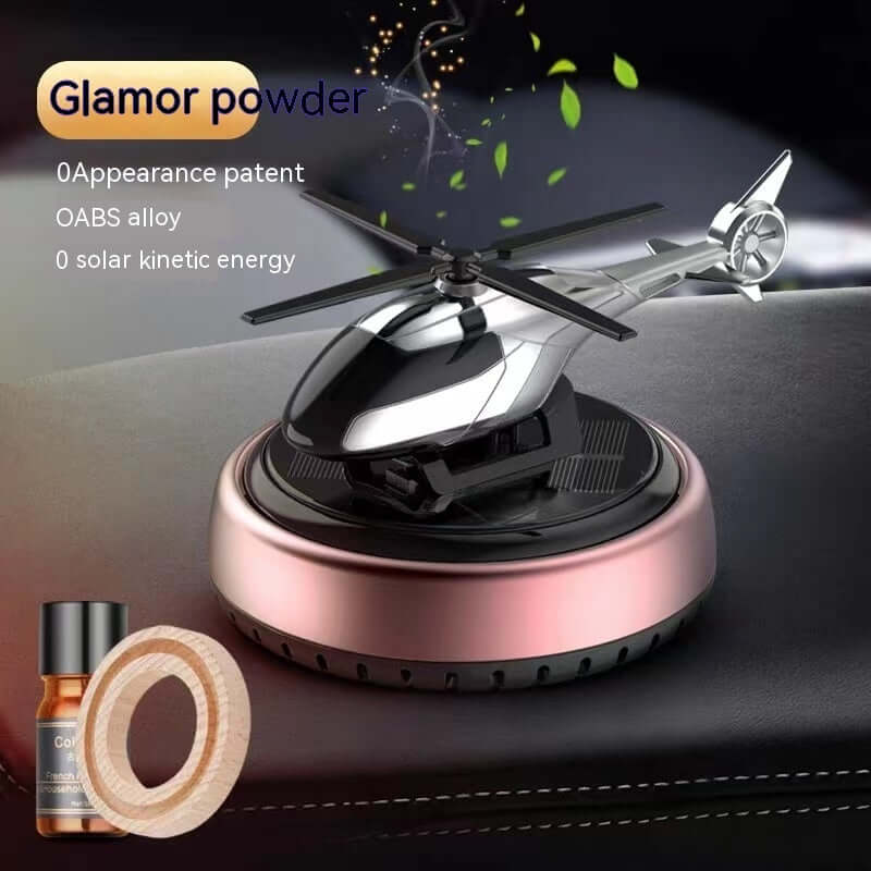 Stylish helicopter car perfume holder in silver and pink, showcasing modern design and kinetic energy features.