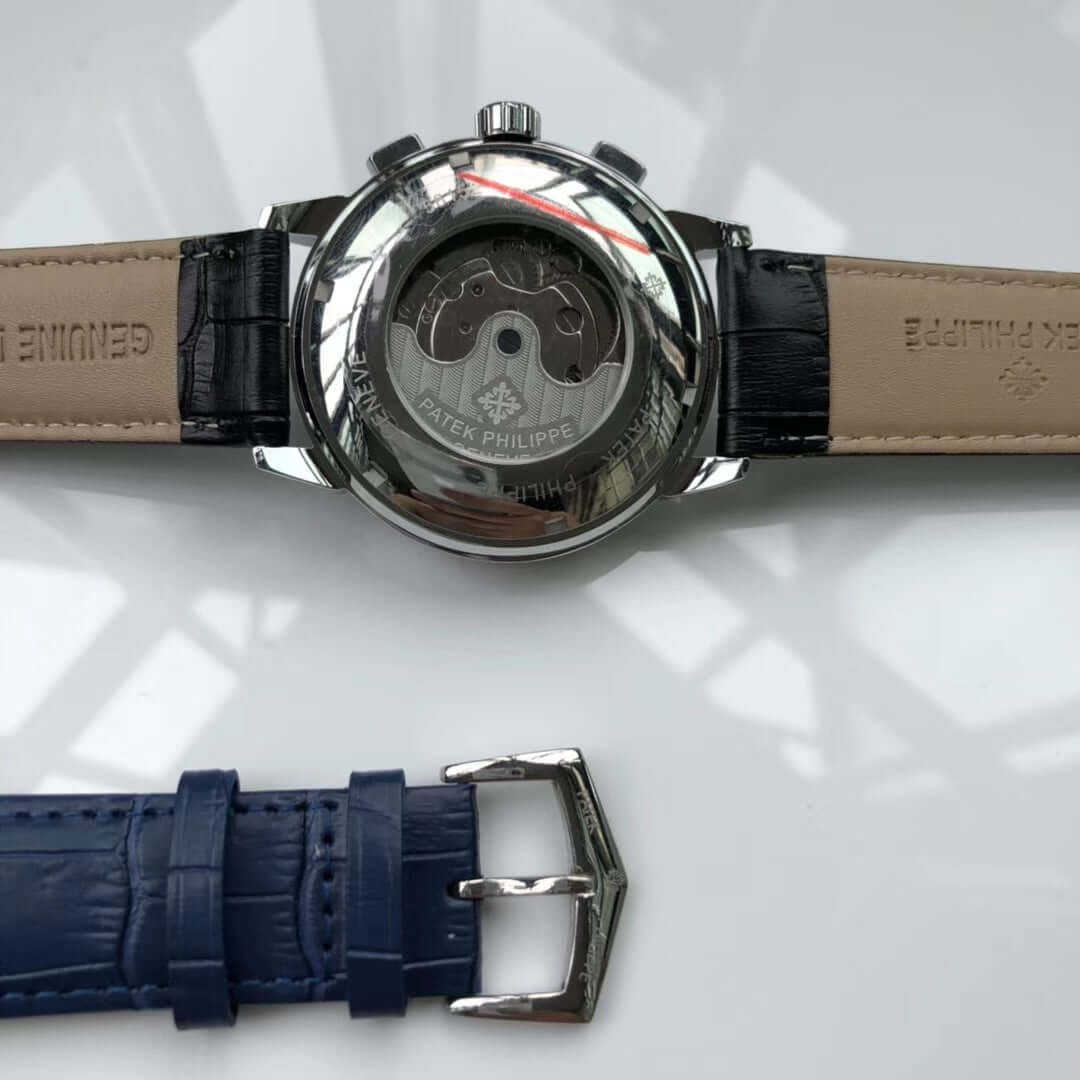 Close-up of a Patek Philippe watch caseback showcasing the mechanical movement and leather strap detail.