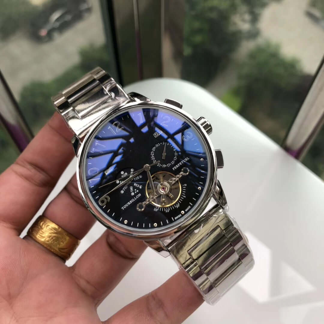 Big flywheel mechanical watch with stainless steel strap, featuring a blue dial and various functions, including calendar display.