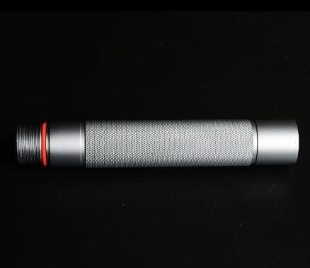 Silver tactical walking stick with textured grip and red accent on dark background.