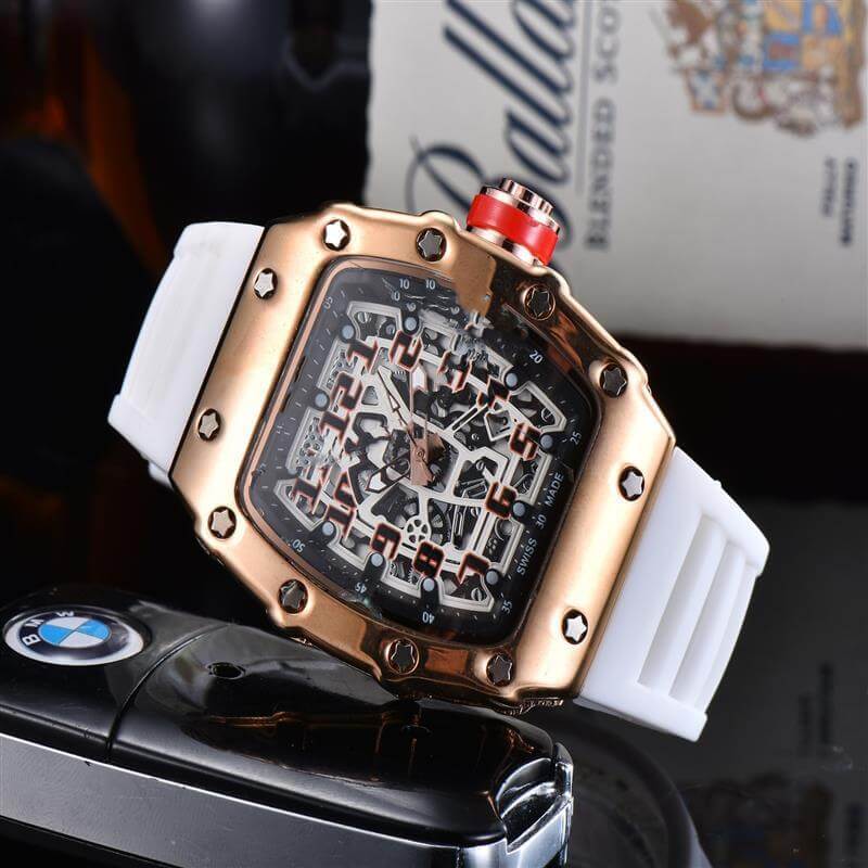 Stylish skeleton quartz watch with a gold and white design, featuring intricate dial details and a rubber strap.