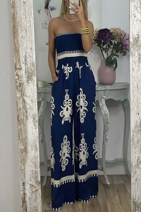 Wrapped chest printed jumpsuit in blue, featuring a high-waisted design and stylish wide legs for women.