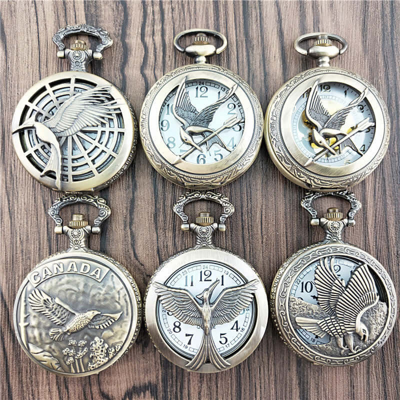Collection of antique vintage bird pocket watches with detailed engravings and unique designs.