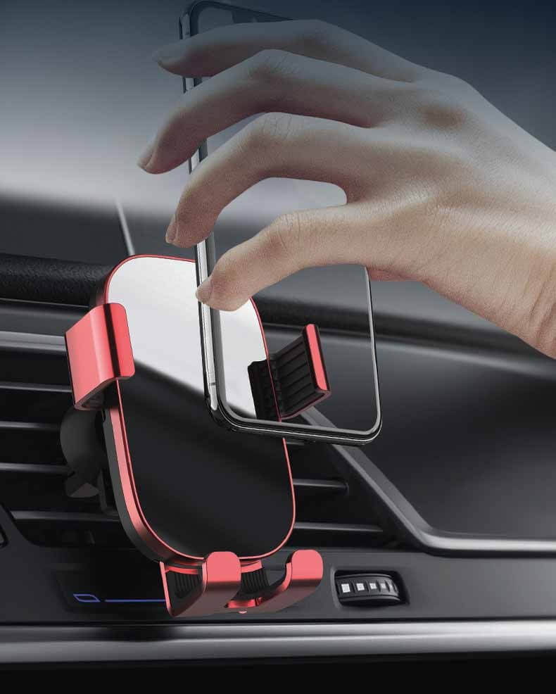 Hand placing phone in a red sucker car phone holder, designed for easy access in vehicles.